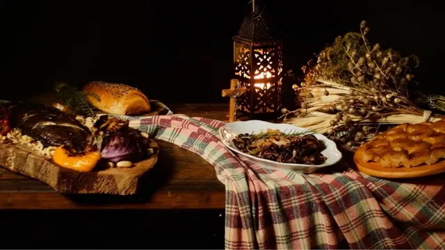 “Na mesa com os santos”