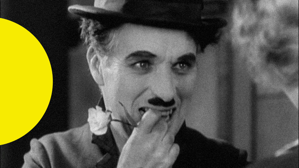 Imagem de Charlie Chaplin em cena do filme "Luzes da cidade"