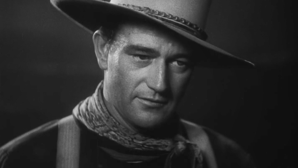 O ator John Wayne em cena do filme "No tempo das diligências", de John Ford.