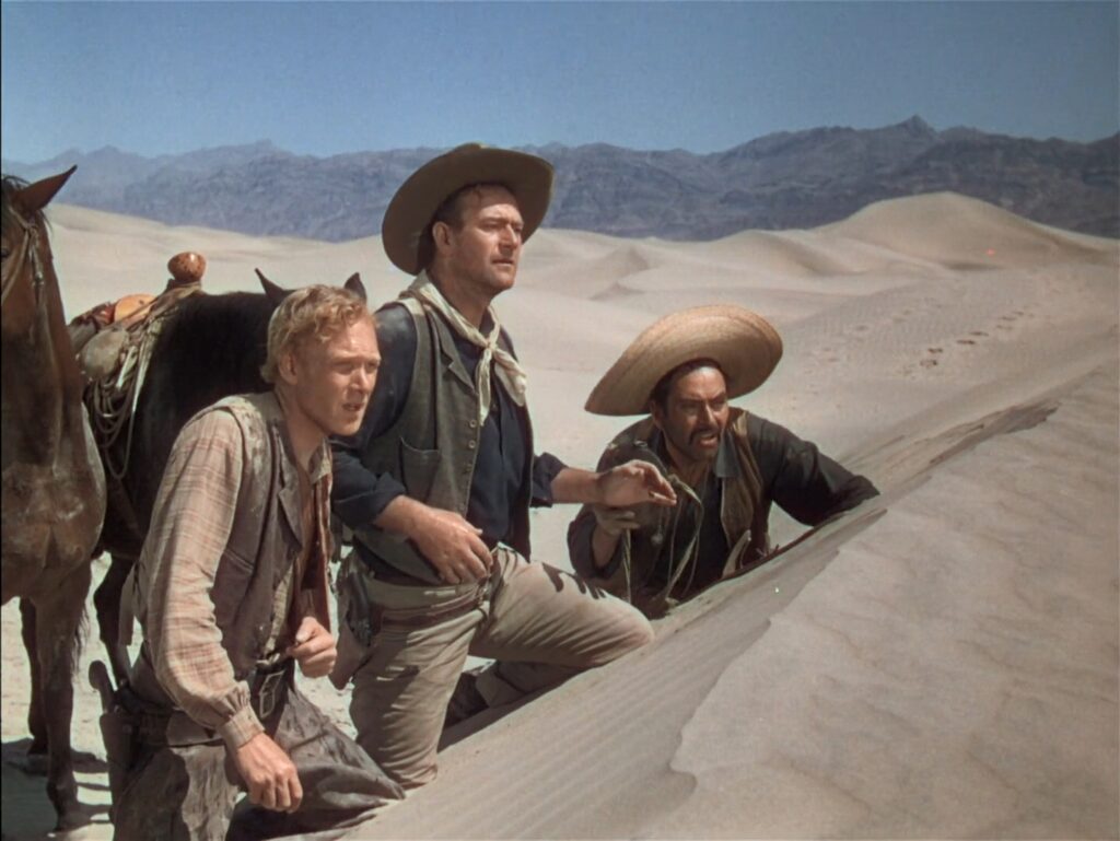 Harry Carey Jr., John Wayne e Pedro Armendáriz em cena do filme "O céu mandou alguém", de John Ford.